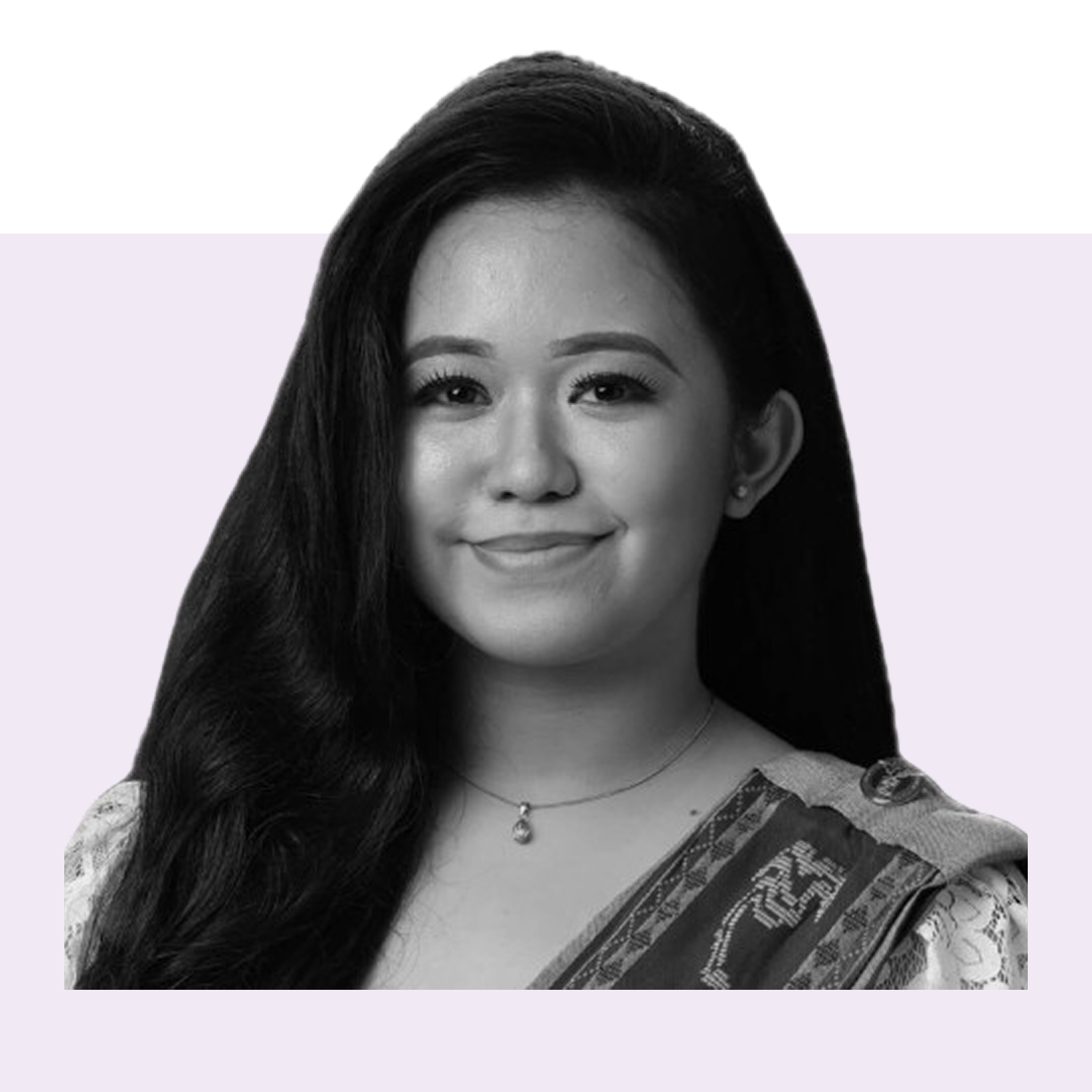 Black and white portrait of a smiling woman with long dark hair.
