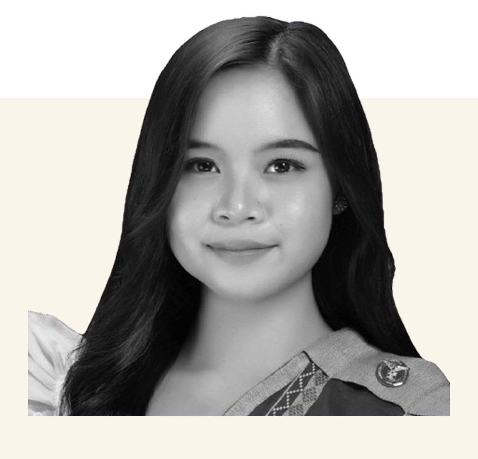 Black and white portrait of a smiling woman with straight dark hair with a sash.