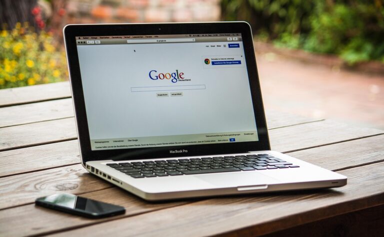 SEO specialist analyzing on-page SEO performance and website optimization metrics on a laptop dashboard.