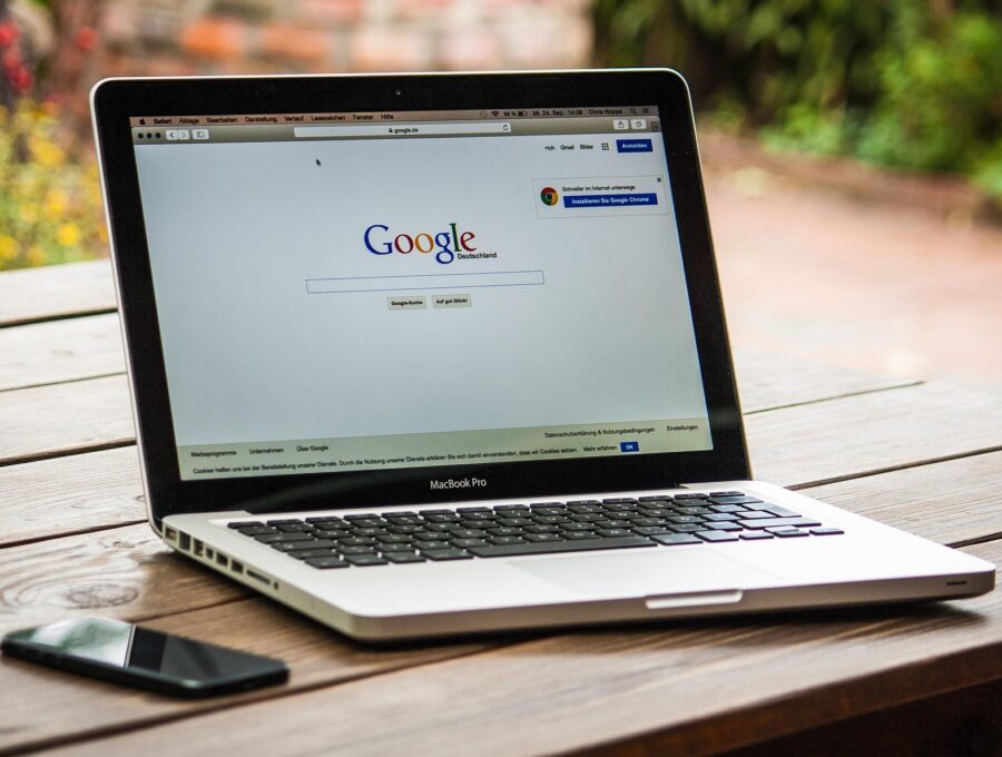 SEO specialist analyzing on-page SEO performance and website optimization metrics on a laptop dashboard.