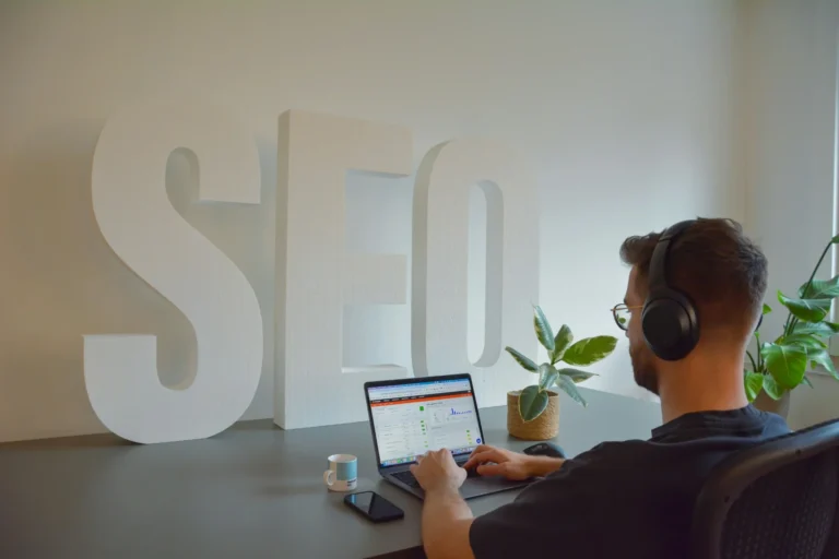 SEO specialist analyzing on-page SEO performance and website optimization metrics on a laptop dashboard.