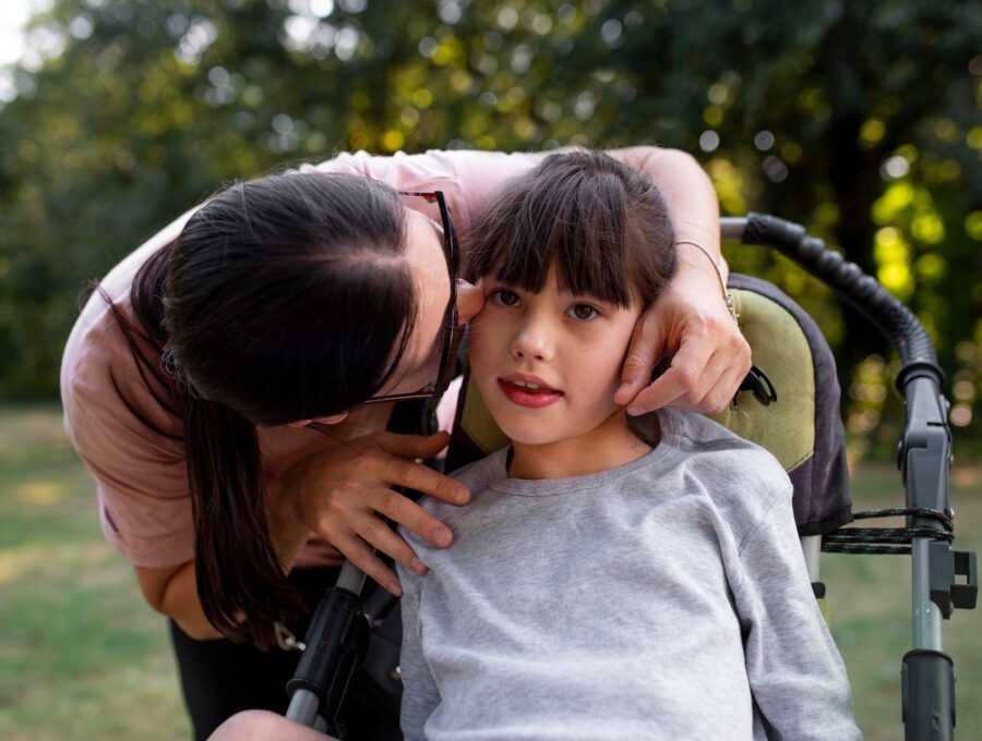Parent and child reviewing vaccine information while considering questions about vaccine hesitancy and autism spectrum disorder